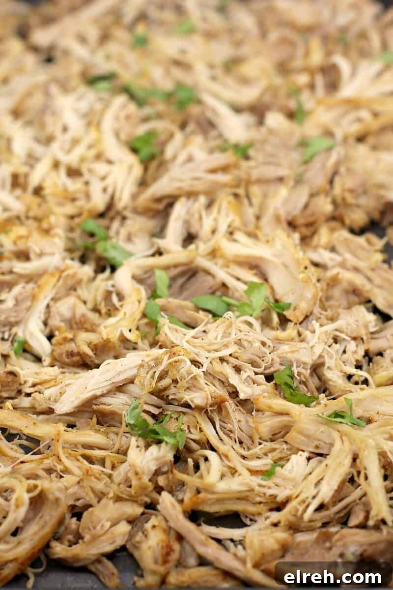 finished chicken topped with cilantro spread on a bake sheet