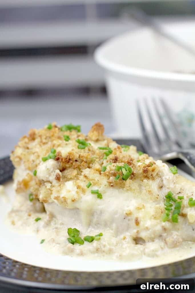 chicken breast on a plate with a fork
