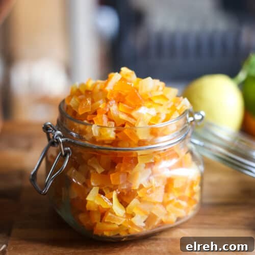 Caramelized Candied Orange Slices Recipe 12 jar of homemade mixed peel on a wooden table