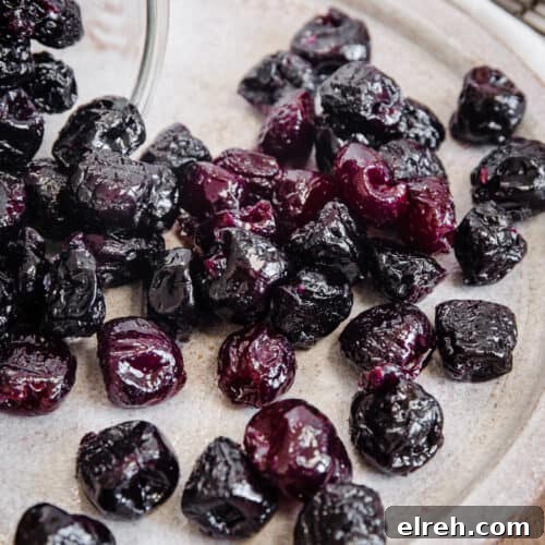Caramelized Candied Orange Slices Recipe 13 cherries spilling from jar