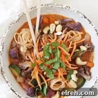 Rainbow Vegetable Curry Noodle Bowls 2 Creamy rainbow vegetable curry noodle bowls with colorful vegetables, noodles, and Thai red curry broth.