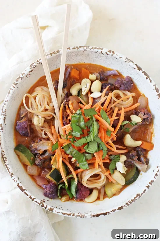 Rainbow vegetable curry noodle bowls with creamy coconut curry broth.