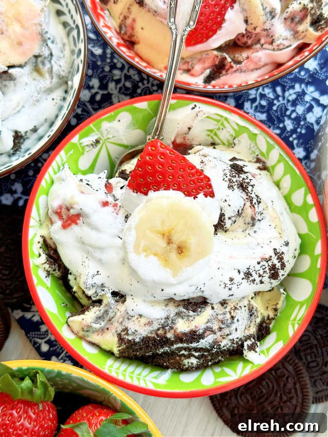 small colorful bowl filled with a serving of strawberry banana pudding