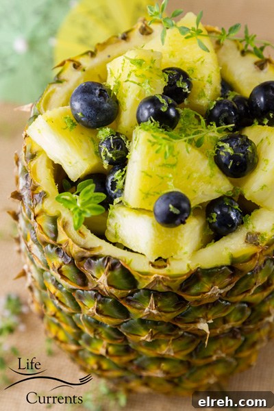 Pineapple Blueberry Fruit Salad in a Pineapple Bowl So yummy and so healthy. It’s the perfect summer treat.