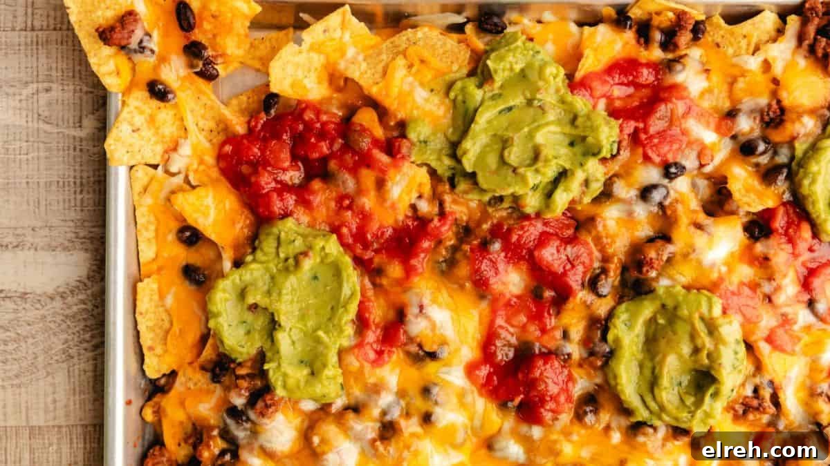 10 Weeknight Dinner Recipes You Will Crave Tomorrow 3 Sheet Pan Nachos on a baking pan.