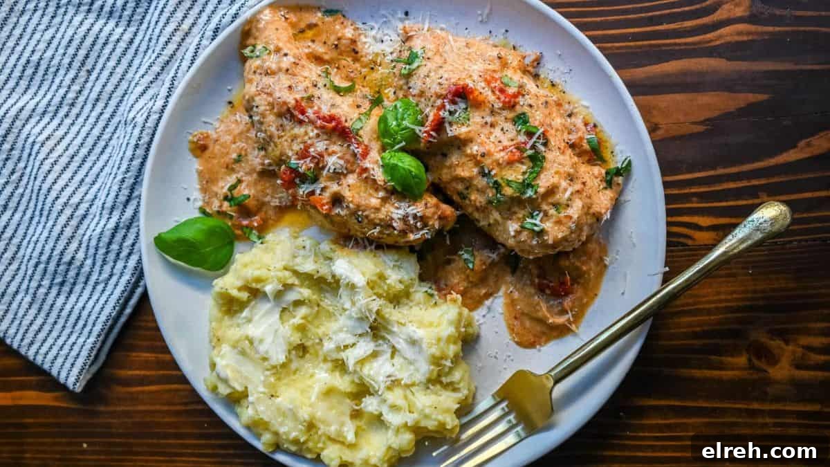 10 Weeknight Dinner Recipes You Will Crave Tomorrow 5 A serving of Marry Me Chicken on a plate with a side of mashed potatoes.