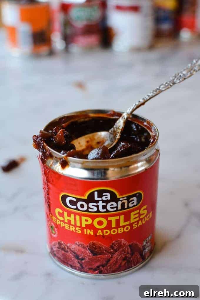 Chipotle Peppers in Adobo Sauce are an essential Mexican ingredient and part of a complete Mexican pantry. See what other ingredients fill my kitchen for easy Mexican meals. #Mexicanfood #Mexicanrecipes #chipotles #mexican