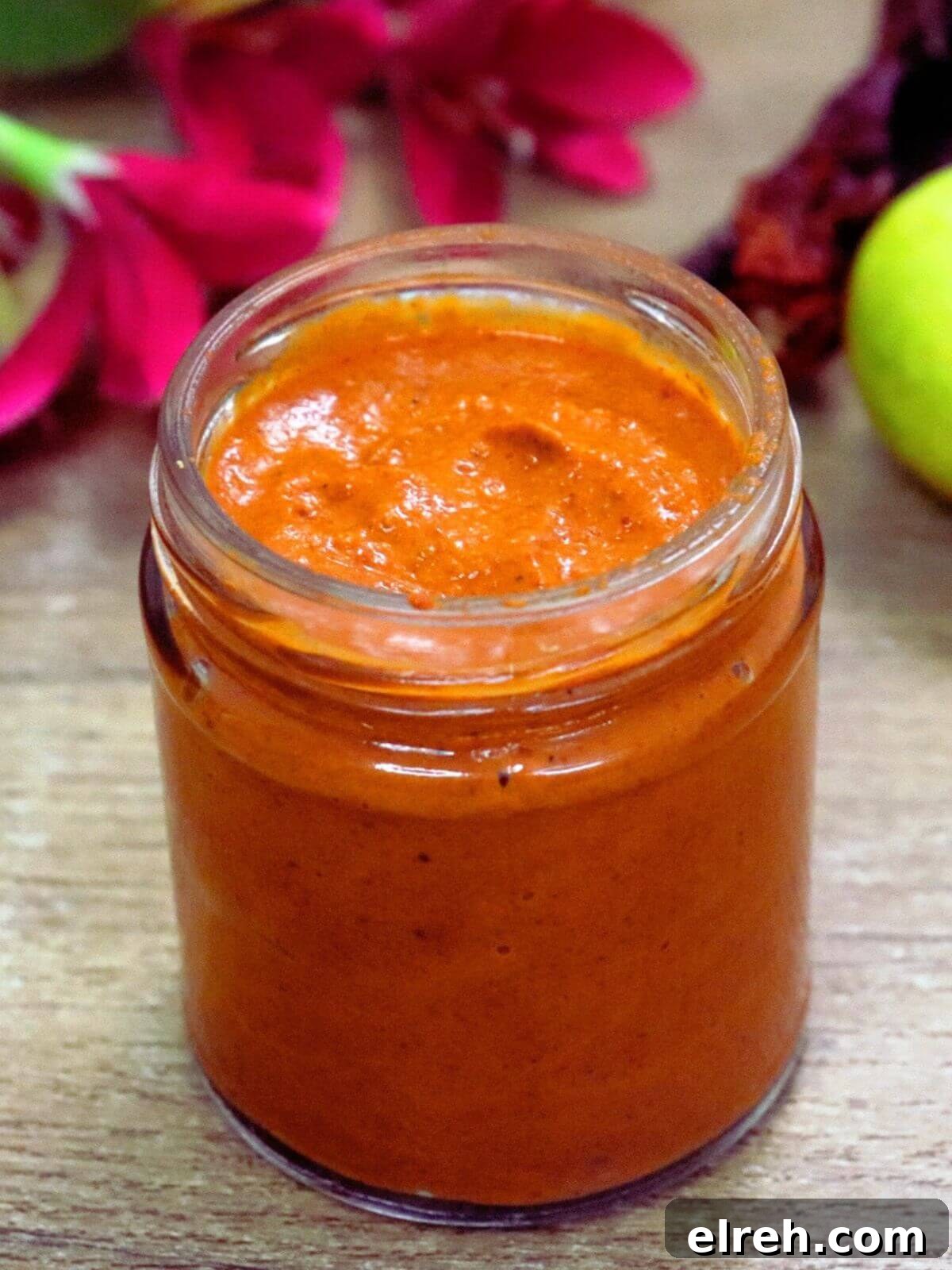 Authentic Homemade Harissa Sauce Recipe 2 Homemade harissa paste in a glass jar.