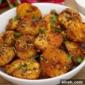 Authentic Homemade Harissa Sauce Recipe 9 roasted mediterranean potatoes in a white colored bowl.