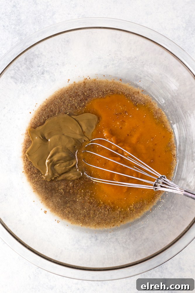 Grain-Free Sweet Potato Breakfast Cookies Recipe 3 sweet potato and SunButter mixed in pyrex bowl by Flora & Vino