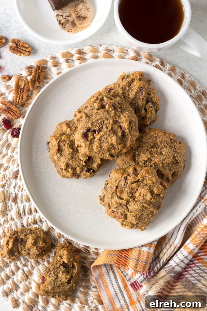 Grain-Free Sweet Potato Breakfast Cookies Recipe 6 Grain-Free Sweet Potato Breakfast Cookies served on a plate with a mug of coffee by Flora & Vino