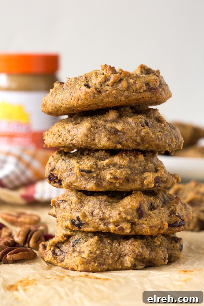 Grain-Free Sweet Potato Breakfast Cookies Recipe 7 Grain-Free Sweet Potato Breakfast Cookies stacked on parchment paper by Flora & Vino