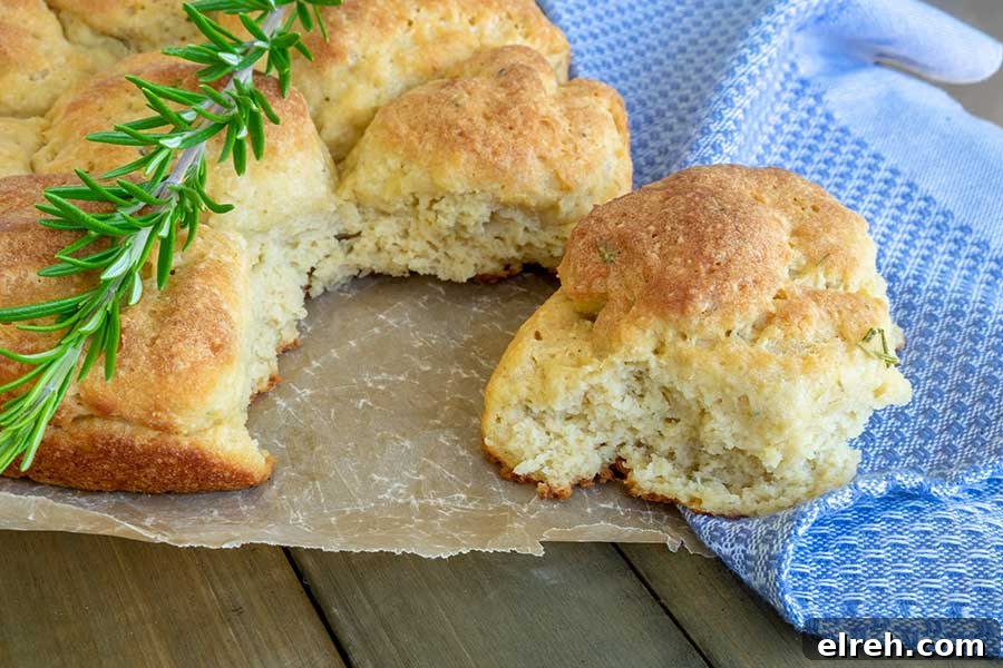 11 Gluten-Free Rolls and Buns: Soft, Fluffy Recipes 11 Best Gluten-Free Pull-Apart Soft Rolls, soft, pillowy, showing the interior how moist they are on a wooden board