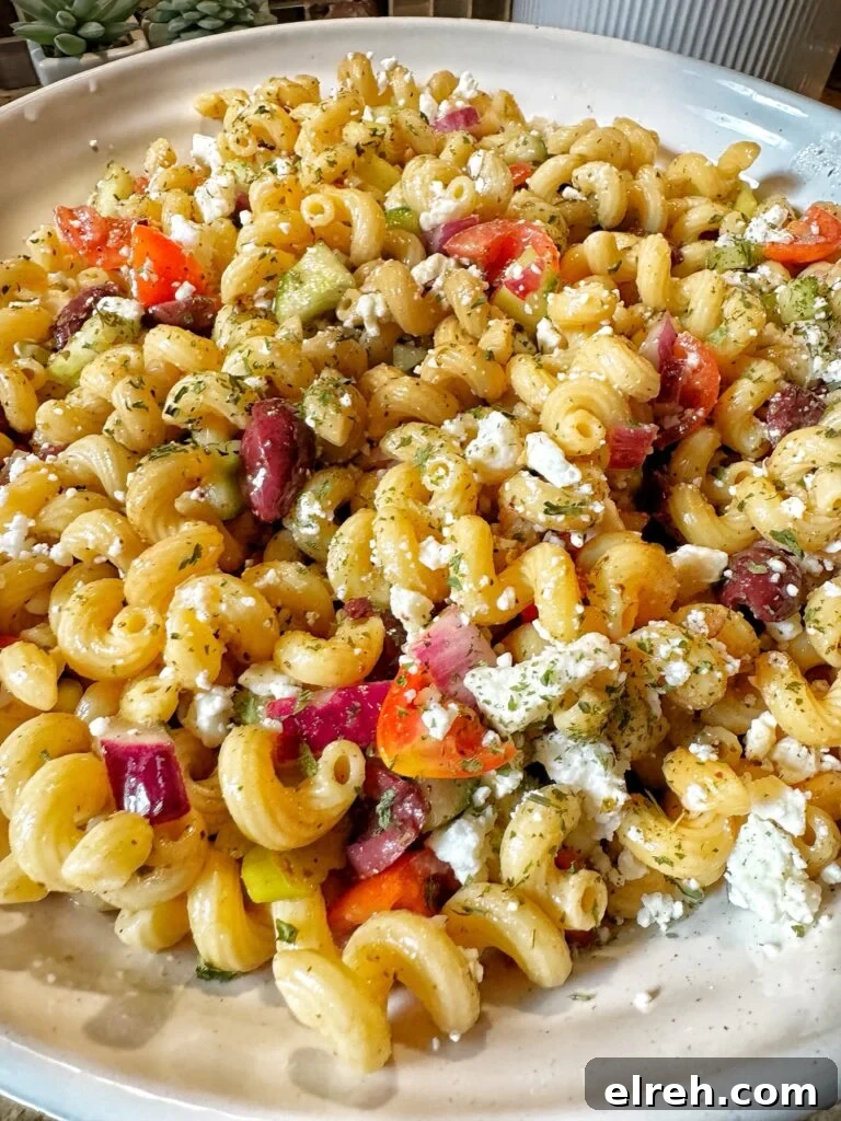 Corkscrew pasta with feta cheese and olives and peppers and tomatoes