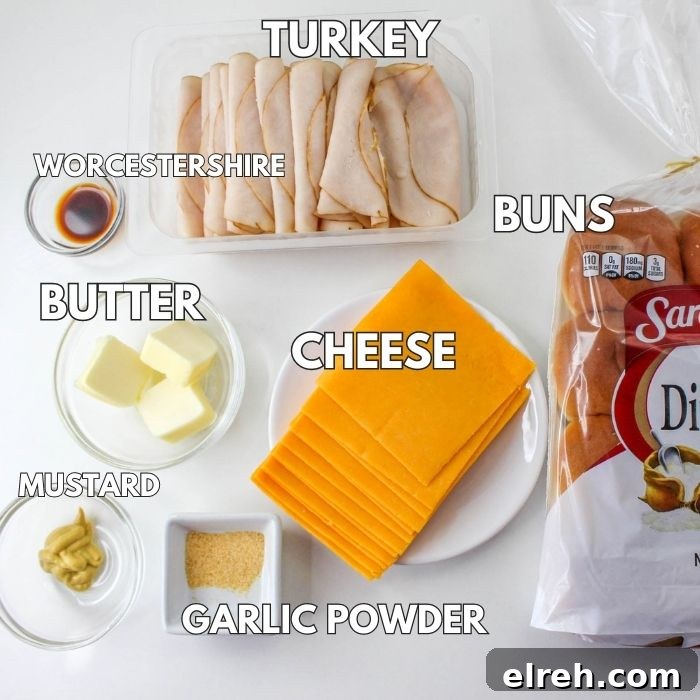 Ingredients to make turkey sliders on white table 