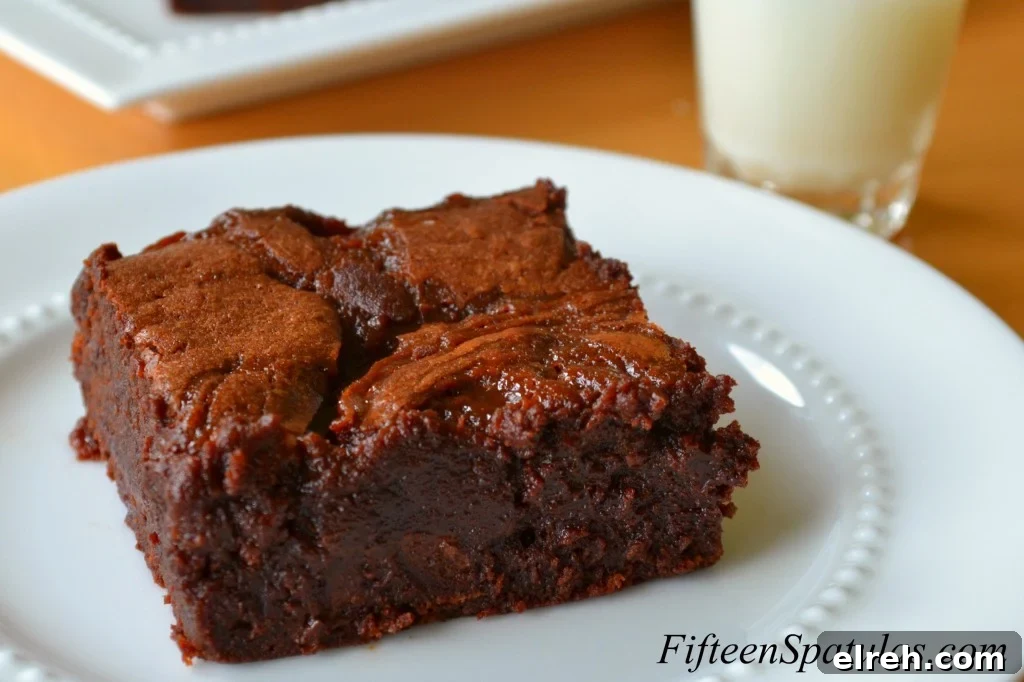 BourbonButterscotchBrownies Butterscotch Brownie - In Square Shape on White Plate with Bourbon Butterscotch Swirl Throughout