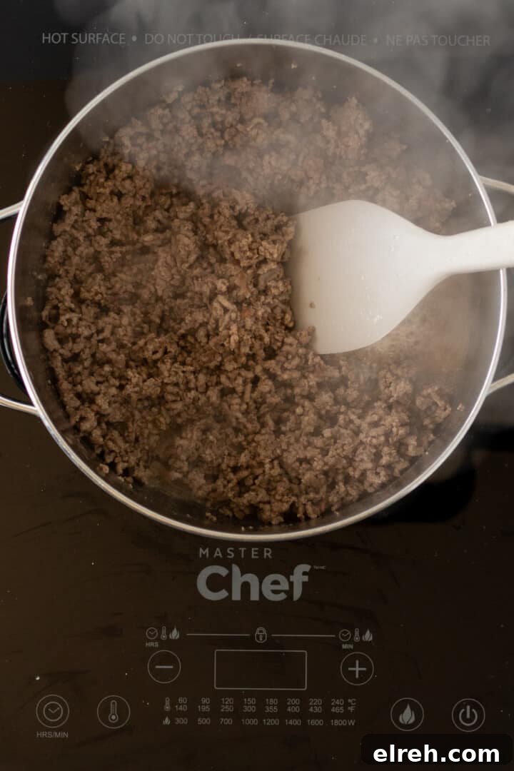 cooking ground beef in large soup pot.