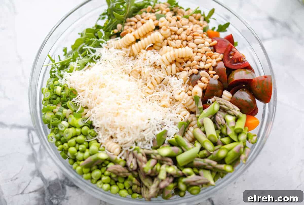 Creamy Green Goddess Pasta Salad with Avocado and Herbs 4 Process shot of all of the pasta salad ingredients in a large bowl.