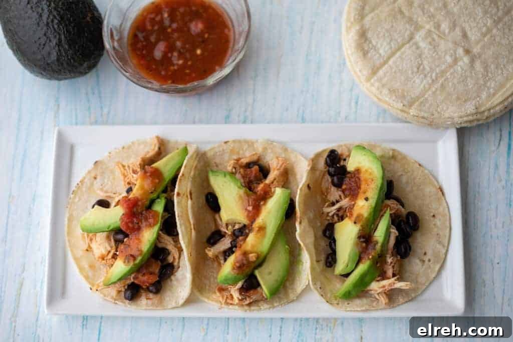 16 Taco Recipes to Transform Weeknight Dinners 2 Three tacos filled with shredded chicken.