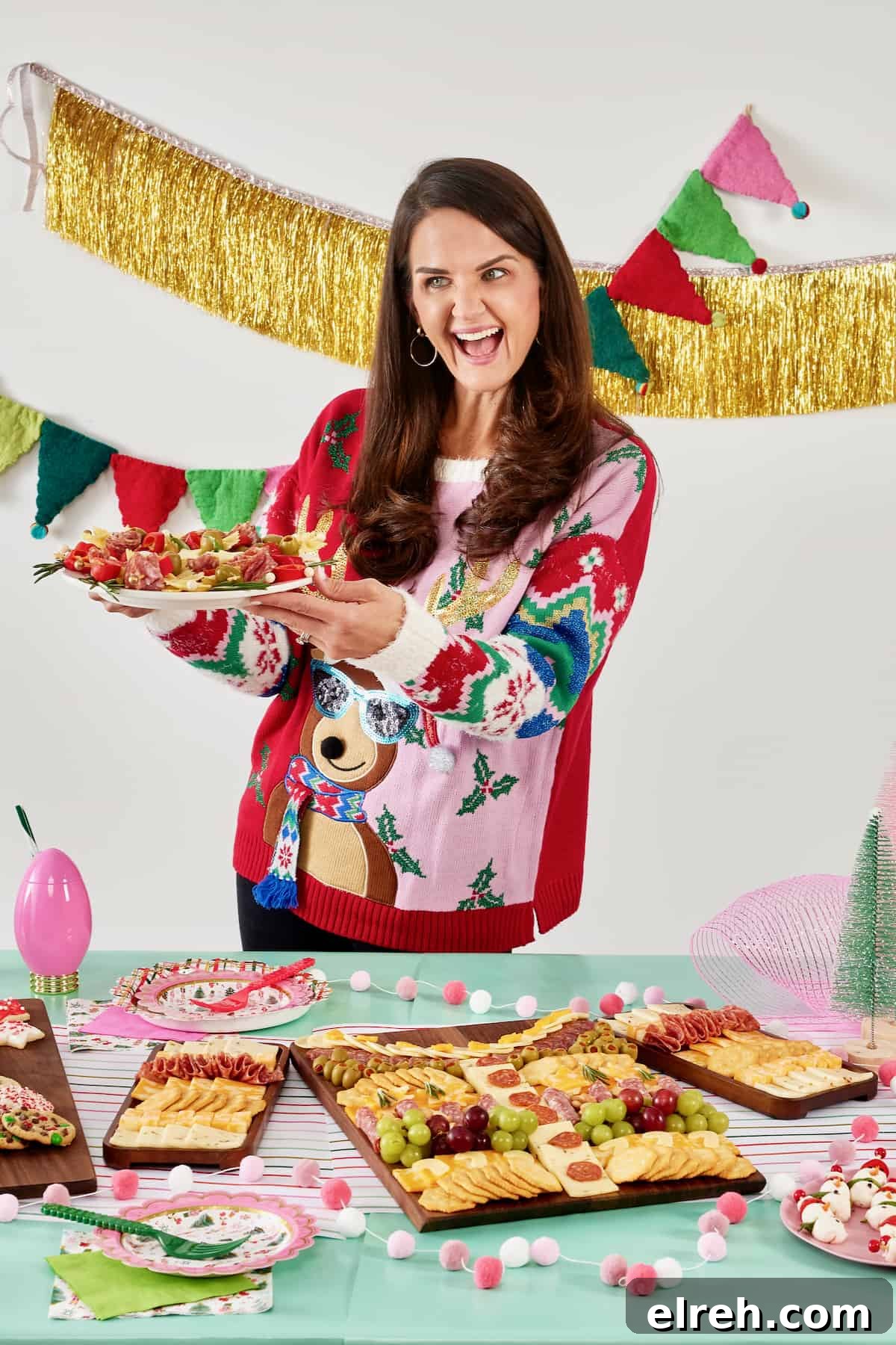 Throw an Ugly Sweater Holiday Party: Ideas and Tips 4 A woman in a Christmas sweater featuring a reindeer wearing glasses.