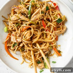 Top view of a bowl of Hakka Noodles with a pair of chopsticks.