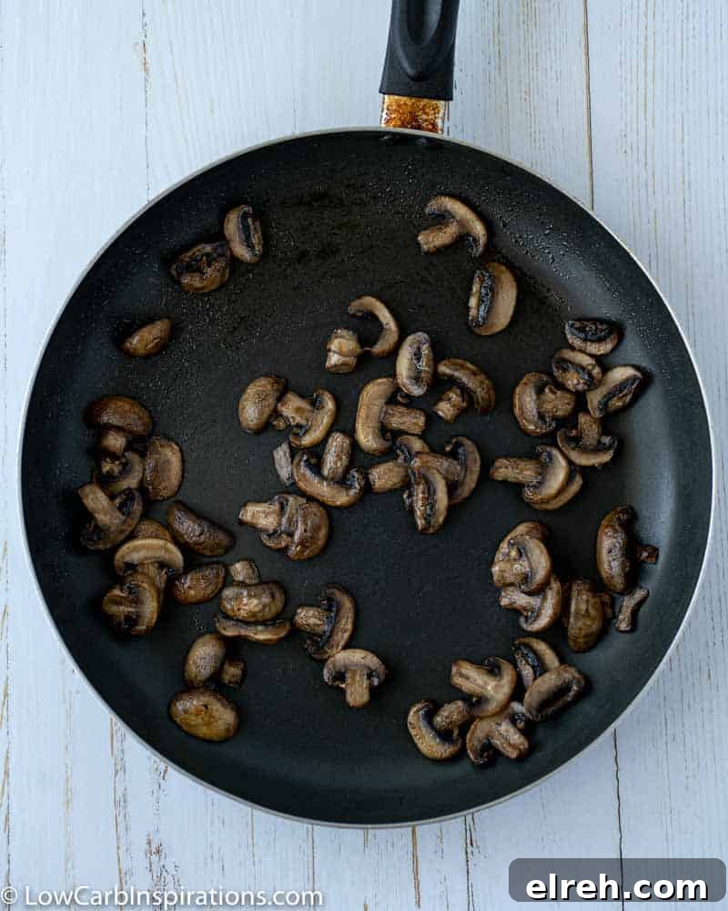 How to Make Mushroom Pizza with Cauliflower Crust 13 cooked and sliced mushrooms in a skillet