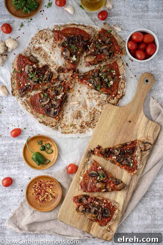 How to Make Mushroom Pizza with Cauliflower Crust 16 overhead view of Mushroom Pizza Recipe with Cauliflower Crust sliced on a wood serving board and parchment paper