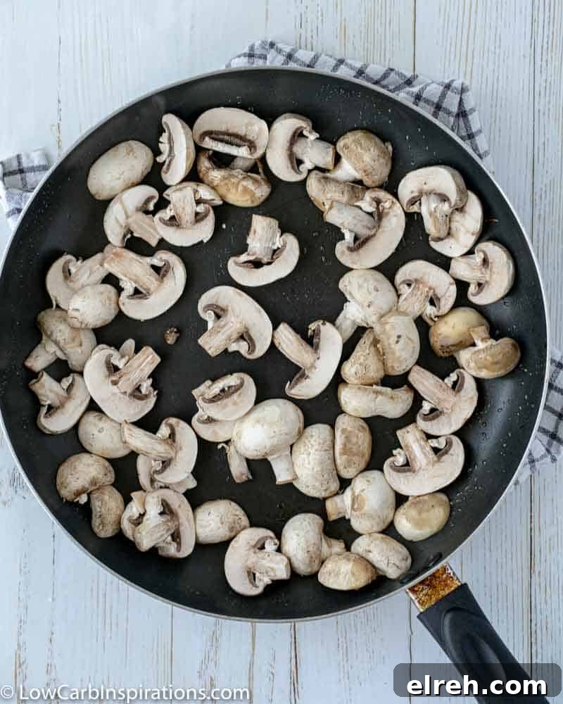 How to Make Mushroom Pizza with Cauliflower Crust 8 sliced mushrooms in a skillet cooking