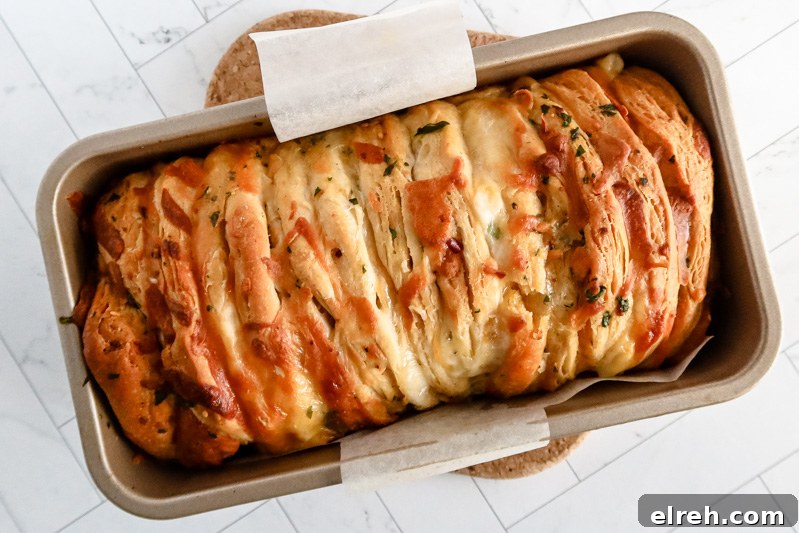Baked pull apart garlic bread made with biscuits.
