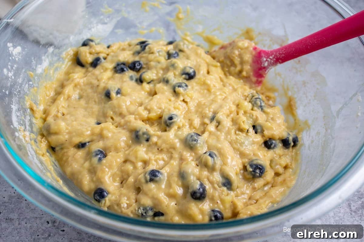 Muffin batter with blueberries.
