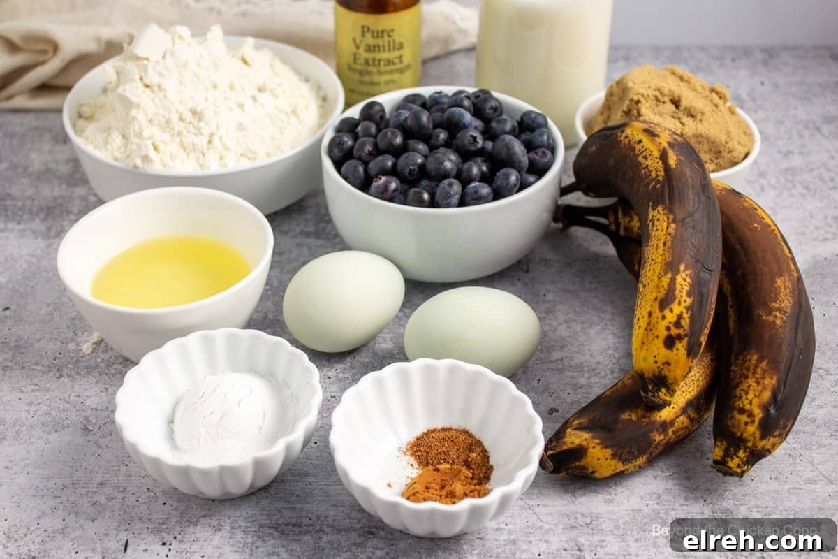Ingredients for making muffins with bananas and blueberries.
