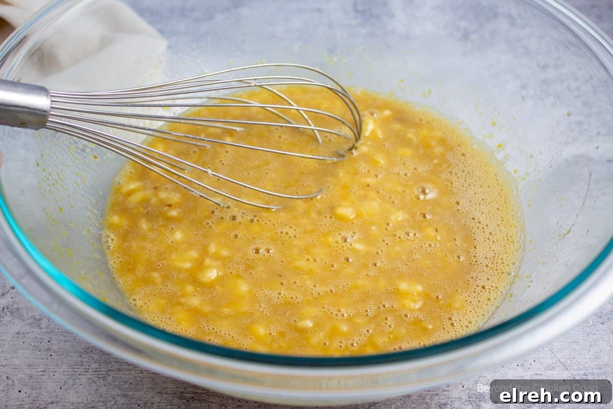 Batter mixed in a glass bowl.