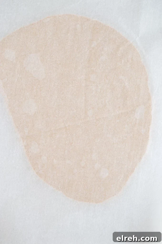 Chocolate Peanut Butter Eggs Recipe 4 peanut butter filling rolled out between two pieces of parchment paper