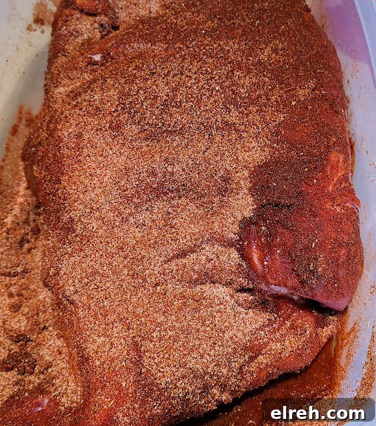 Jim Beam Apple Bourbon Smoked Pork Shoulder injected and rubbed in container
