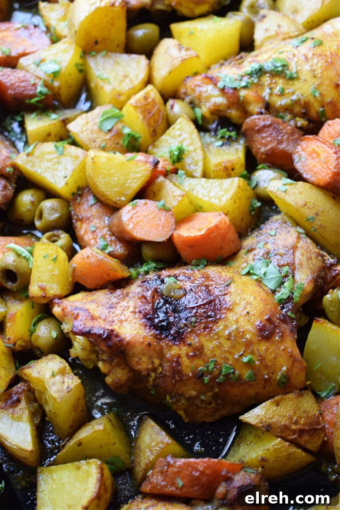 Sheet Pan Moroccan Chicken Dinner with Warm Spices 11 Close up of the Moroccan chicken dinner on a sheet pan.