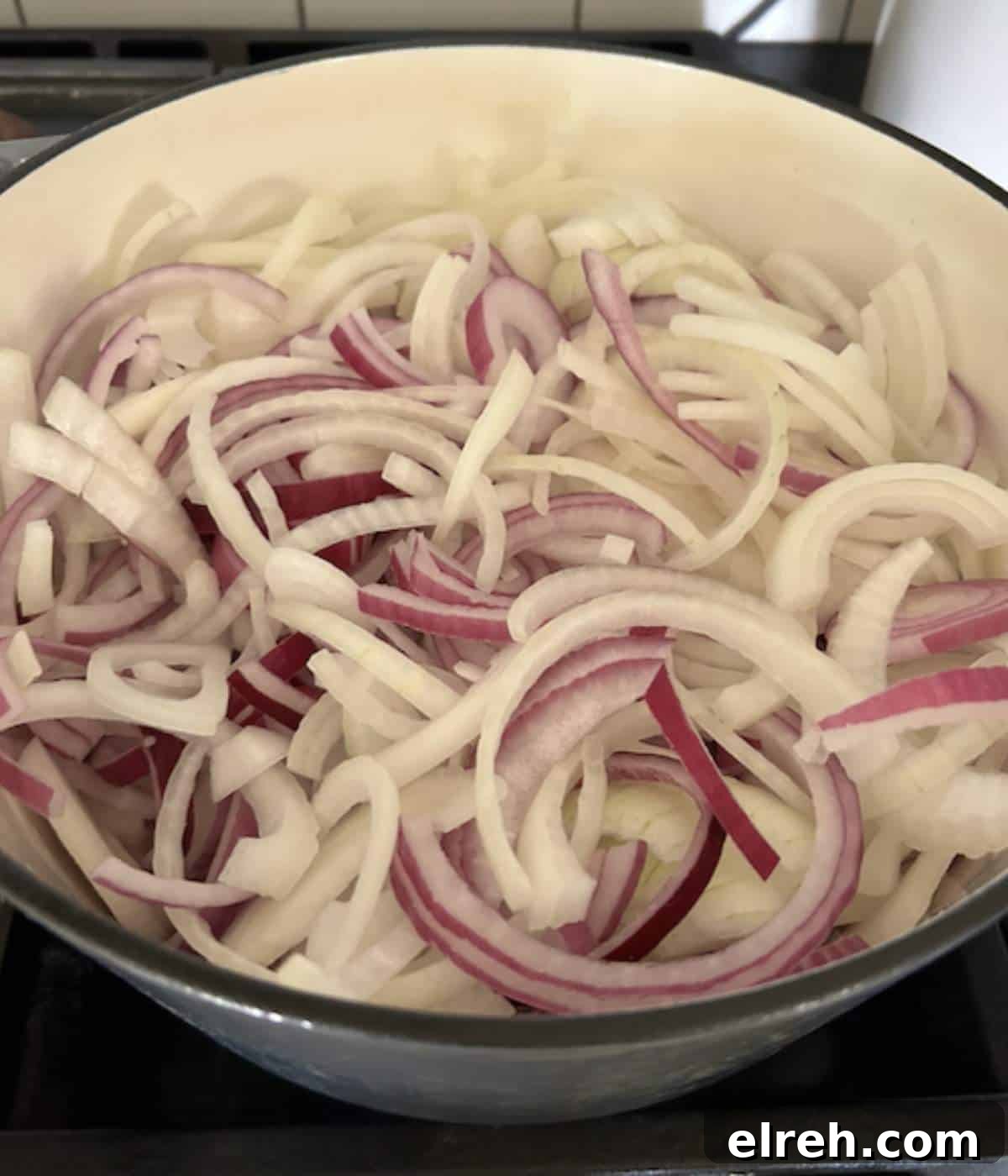 Panera Copycat French Onion Soup Recipe - Bistro-Style 5 Sliced onions in dutch oven.