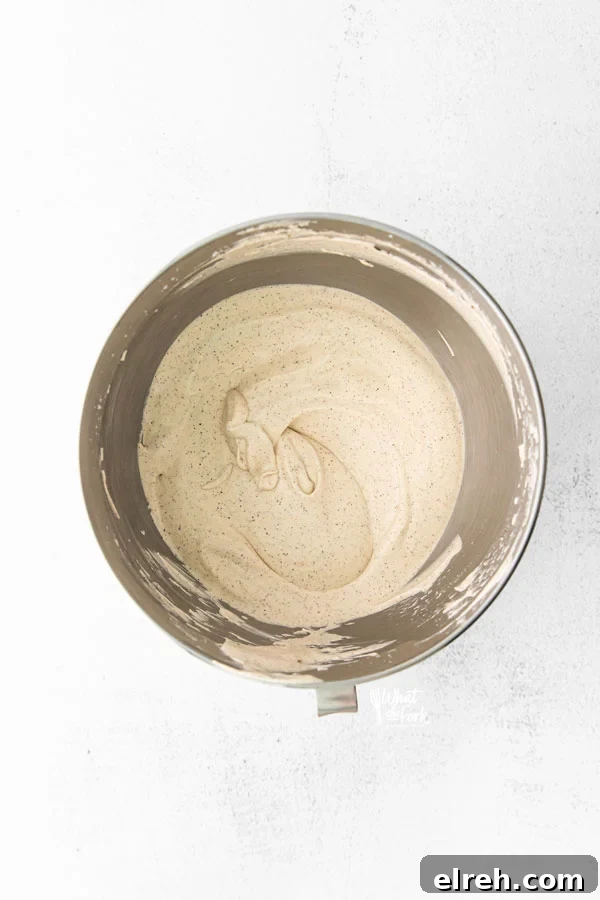 process shot of making a No Churn Coffee Ice Cream Recipe with the ice cream in a mixing bowl