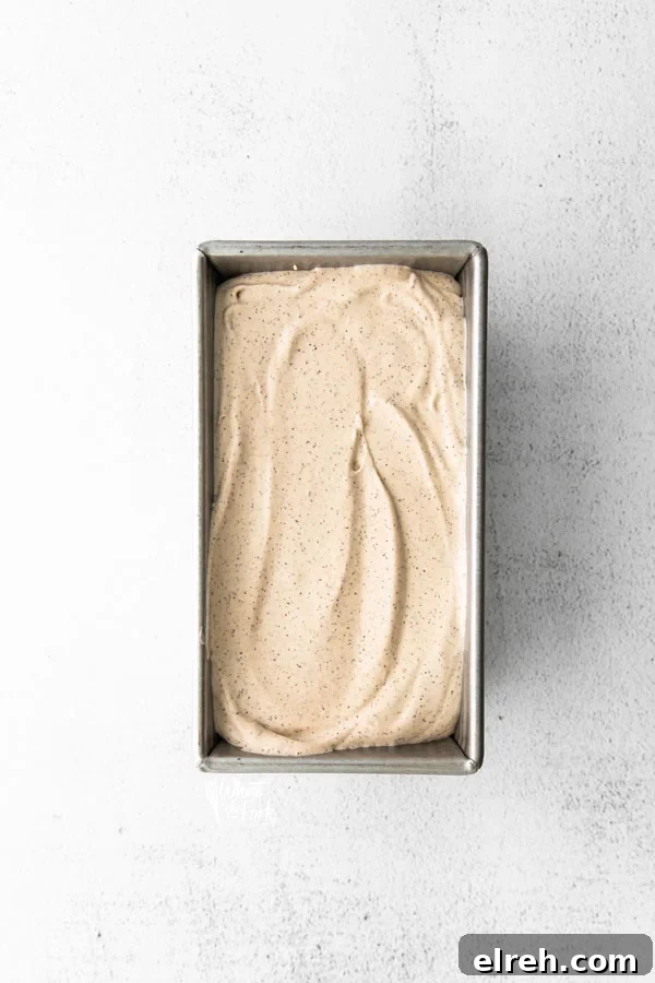 a finished No Churn Coffee Ice Cream Recipe in a metal loaf pan ready to be frozen