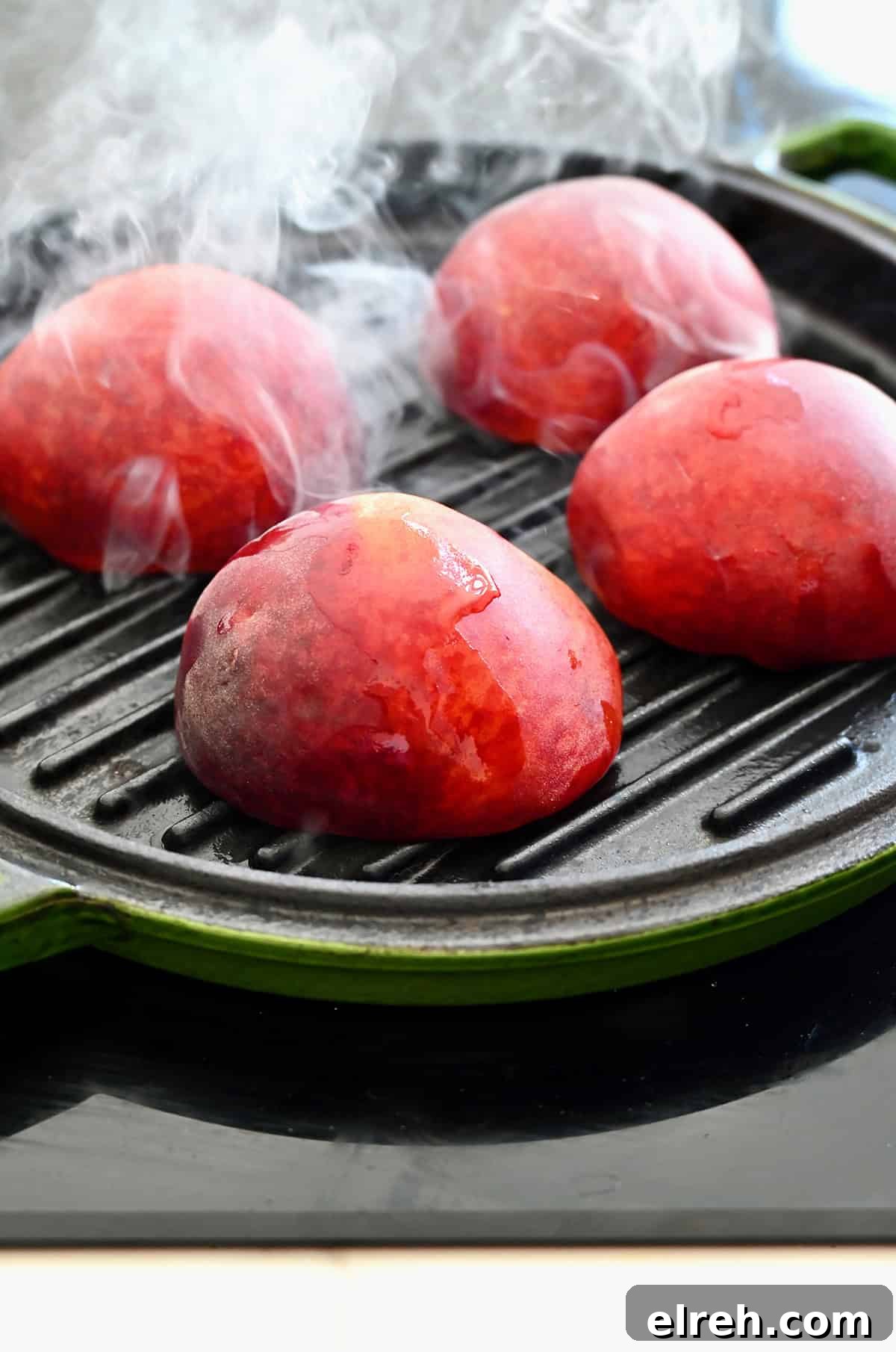 Grilling peaches, cut-side down on a grill pan.
