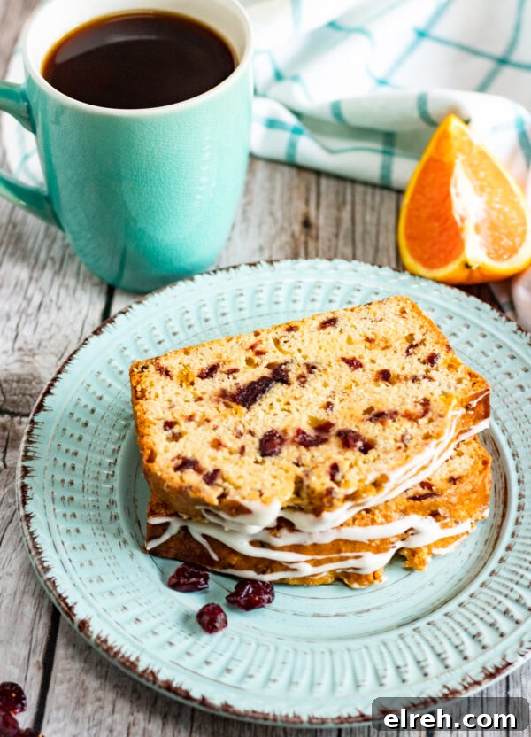 Moist Homemade Cranberry Orange Bread 4 Cranberry Bread Recipe bread on plate