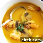 Thai Sweet Potato Soup with Shrimp - A twist on classic Thai soup. Pureed sweet potato, mushrooms plenty of cilantro! Warming and tropical! Gluten Free recipe.