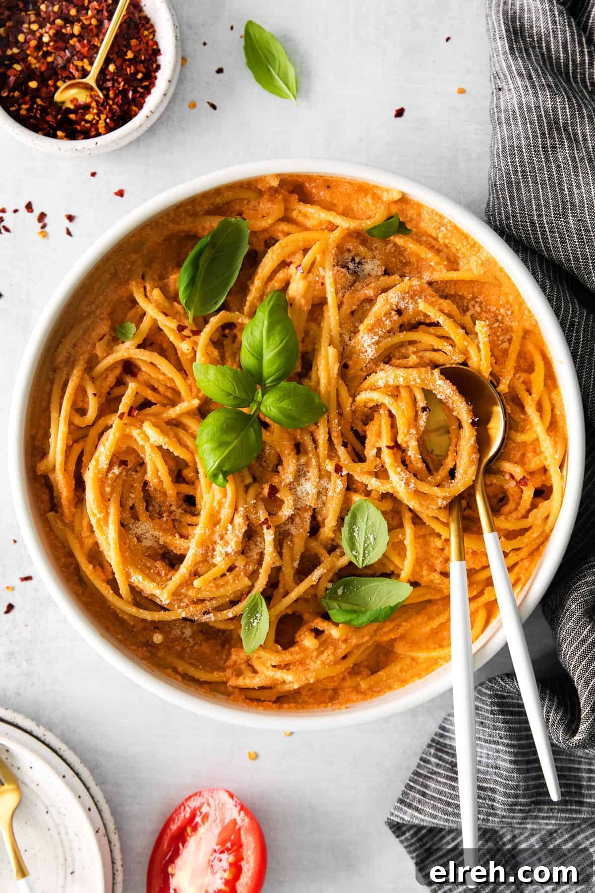 This is the best creamy vegan pasta. It's made with a delicious creamy tomato basil vegan pasta sauce made from cashews and served with your favorite noodle. vegan pasta in bowl