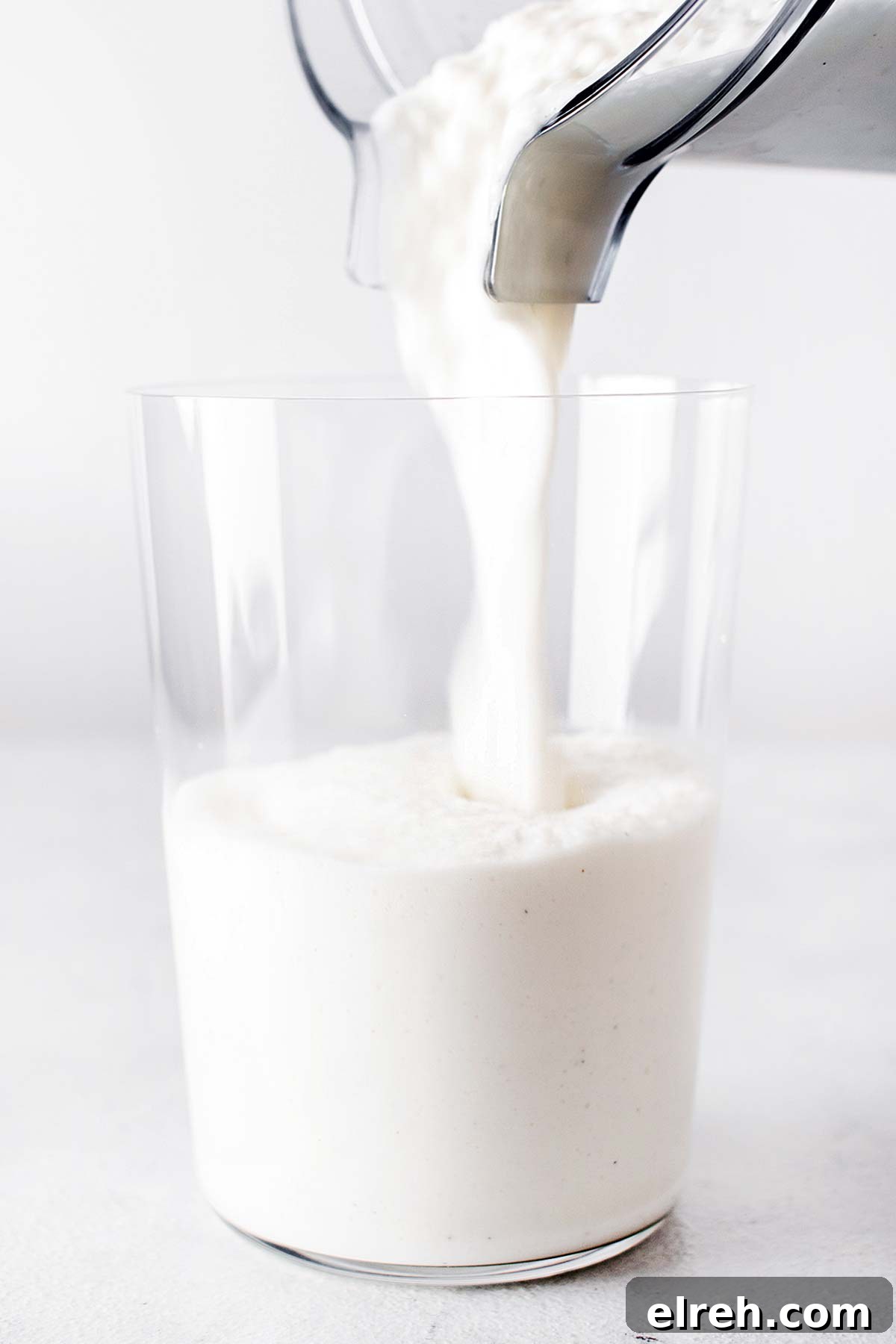 Vanilla Bean Frappuccino Starbucks Copycat Recipe 7 Pouring Frappuccino in a cup.