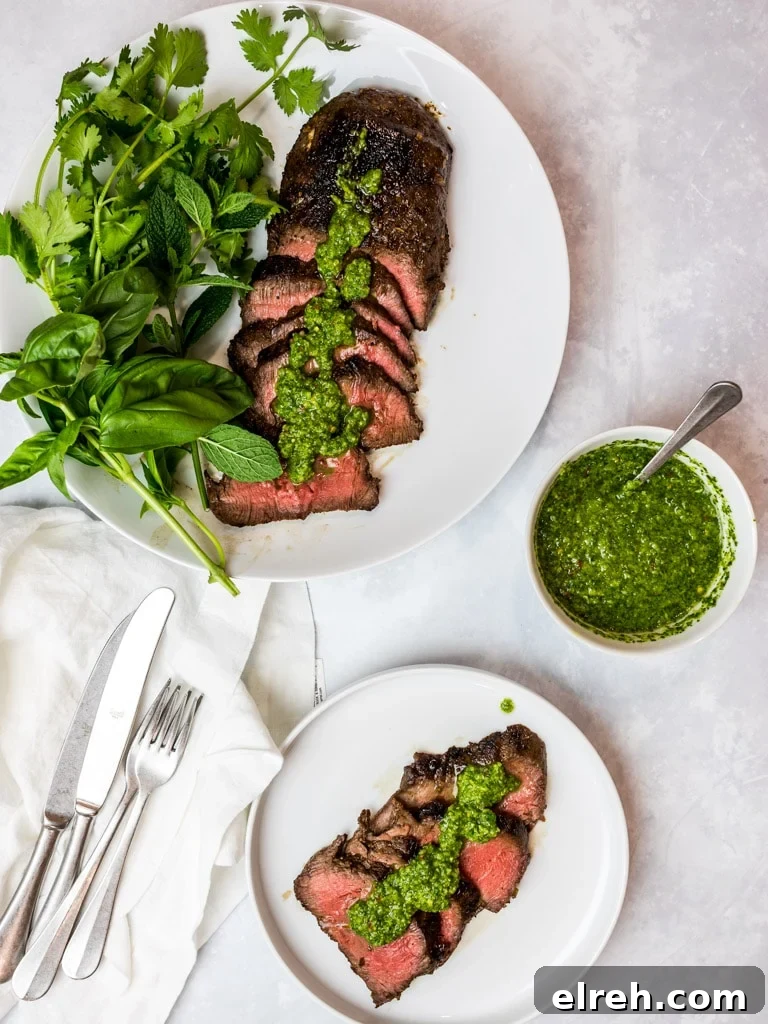 Asian marinated flank steak, spicy Asian chimichurri steak on white plates