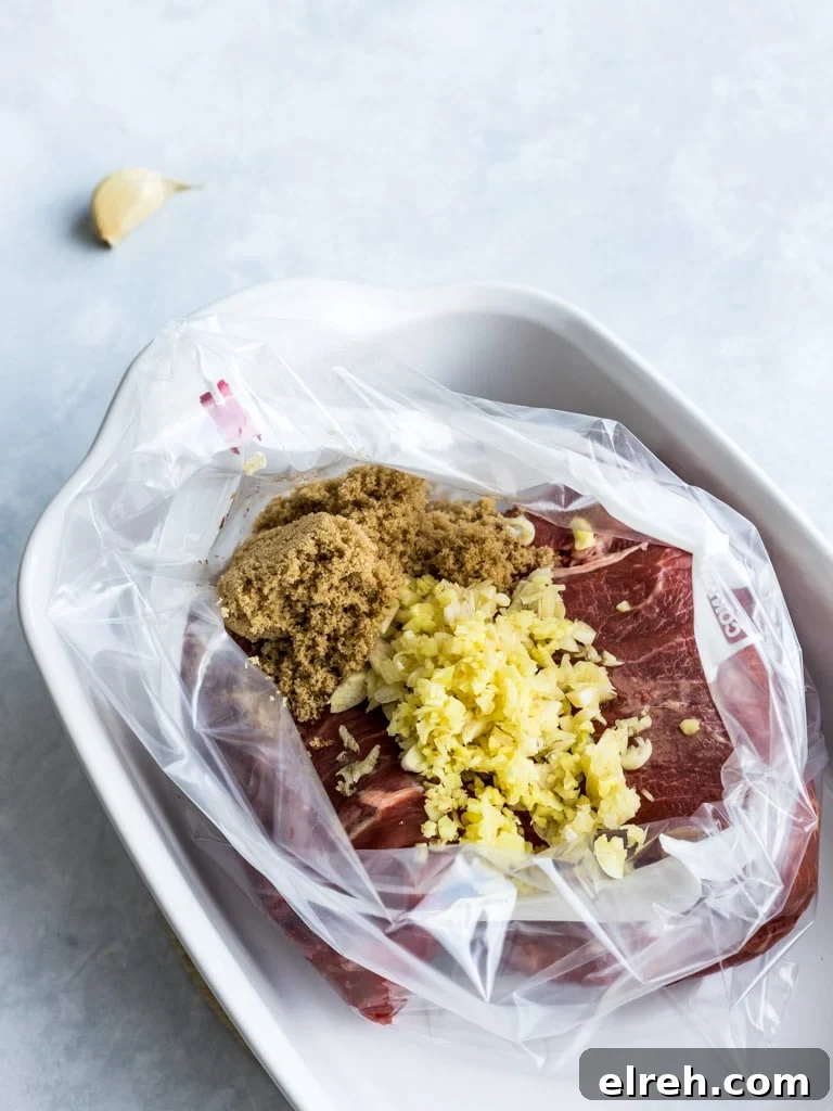 Flank steak marinated with brown sugar and garlic in a plastic ziplock bag