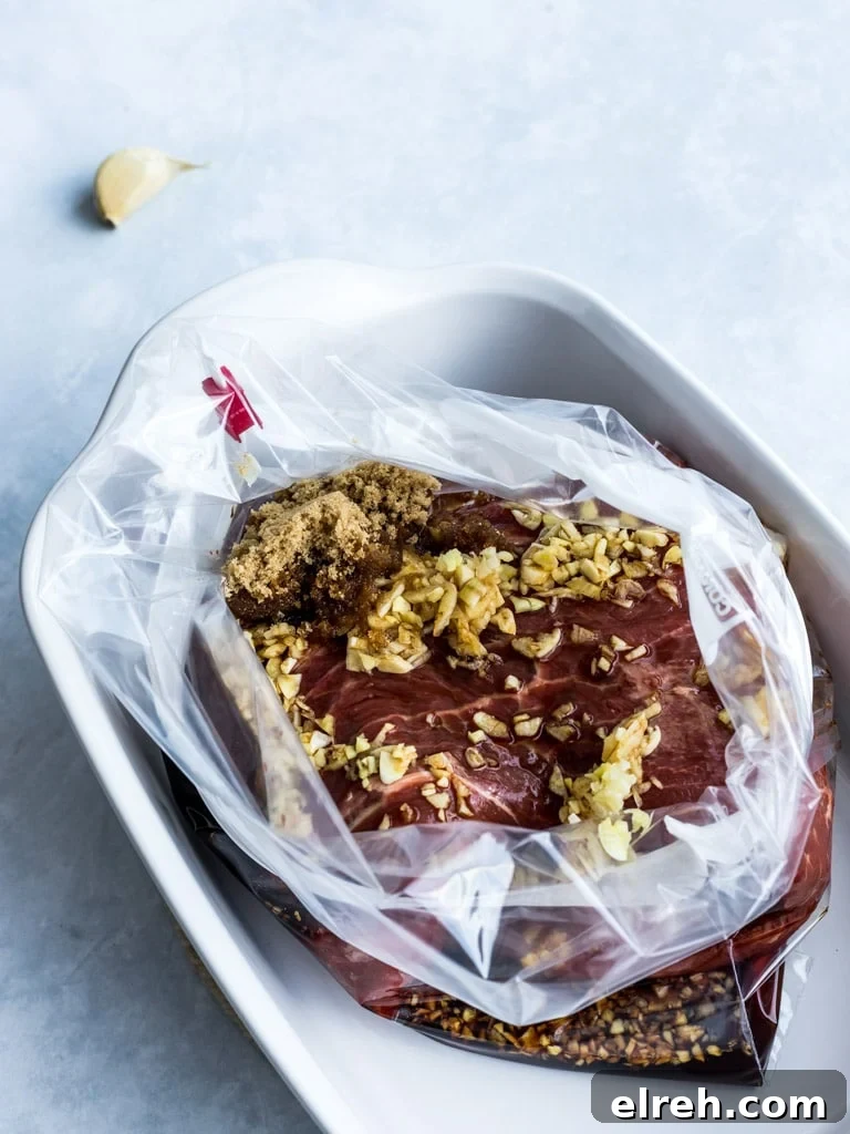 Asian flank steak marinade with brown sugar, soy sauce, and garlic in a plastic bag