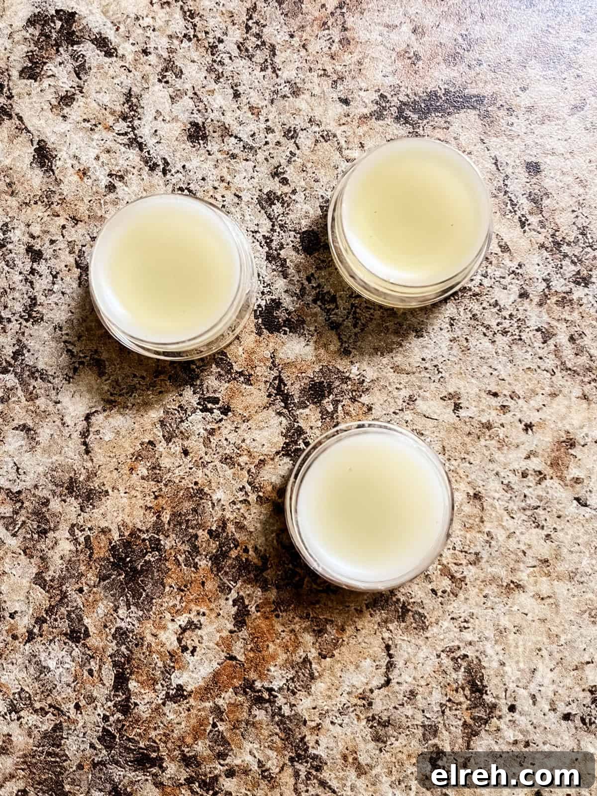 How to Make Tallow Lip Balm for Soft, Hydrated Lips 7 Tallow lip balm in lip balm containers.