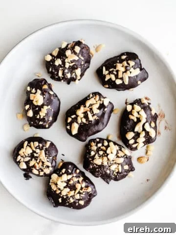 Chocolate-dipped dates on a plate.
