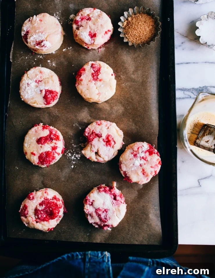 Round unbaked raspberry fruit scones | sophisticatedgourmet.com