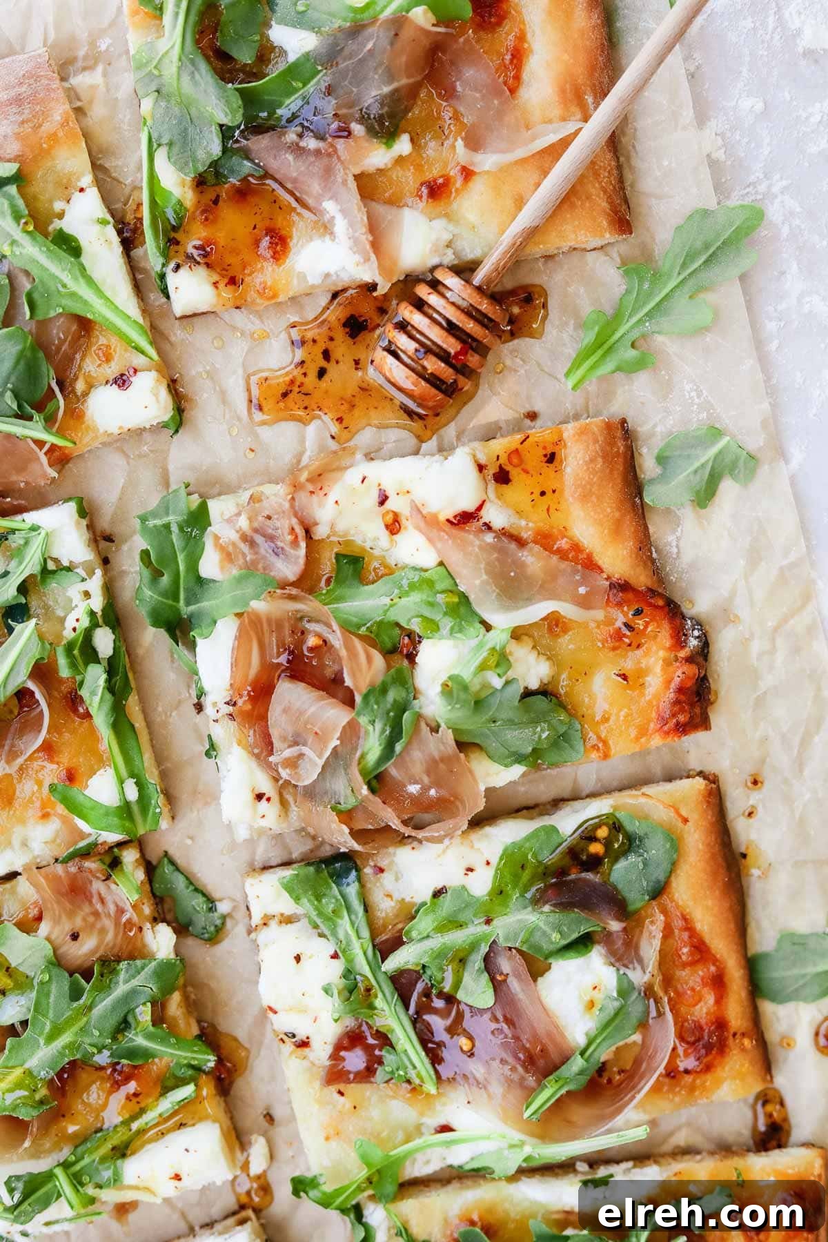 22 Delicious Sides to Serve with Chicken Wings 17 Prosciutto ricotta pizza with arugula and hot honey on parchment paper.